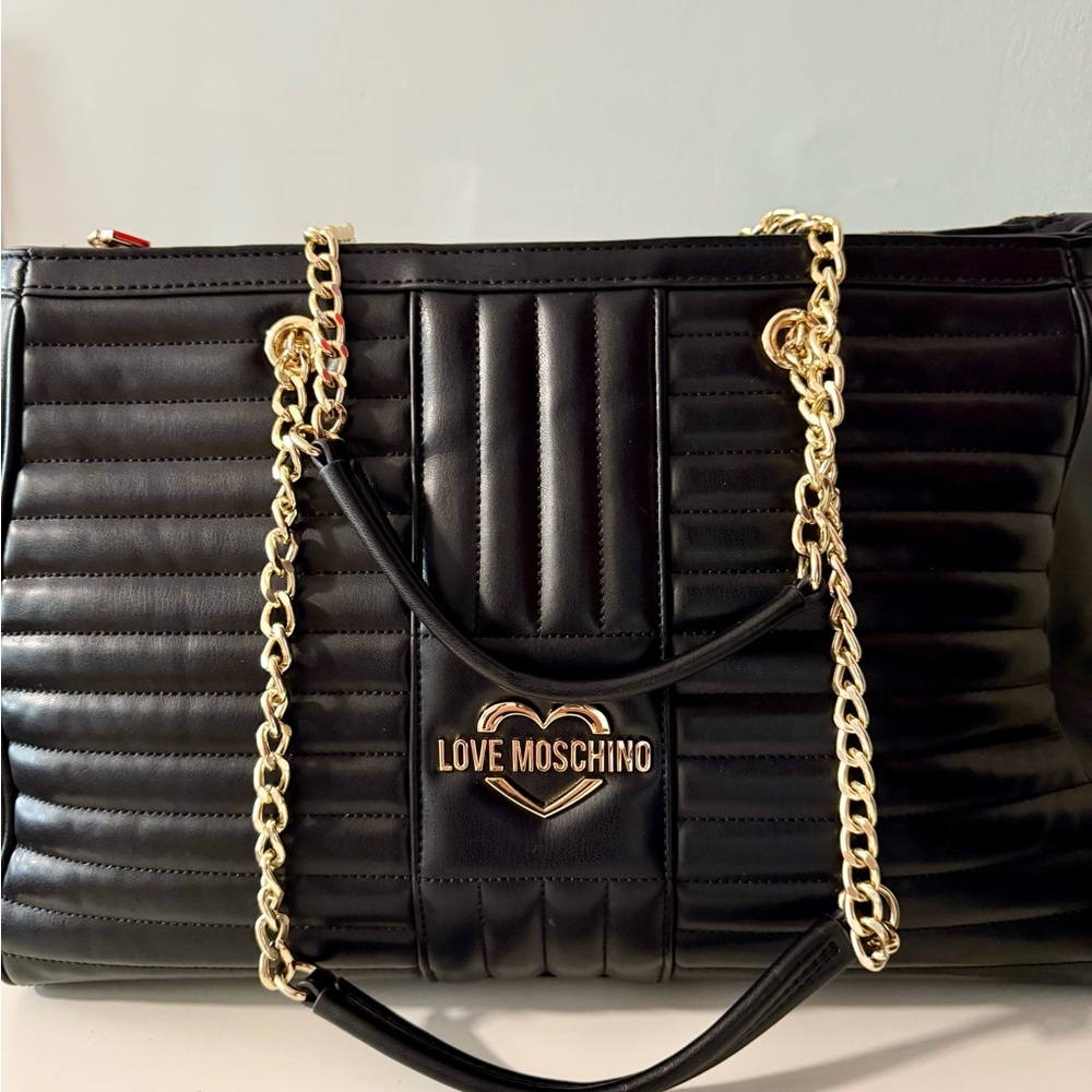 Love Moschino Black Quilted Toye Bag with Gold Chain .
